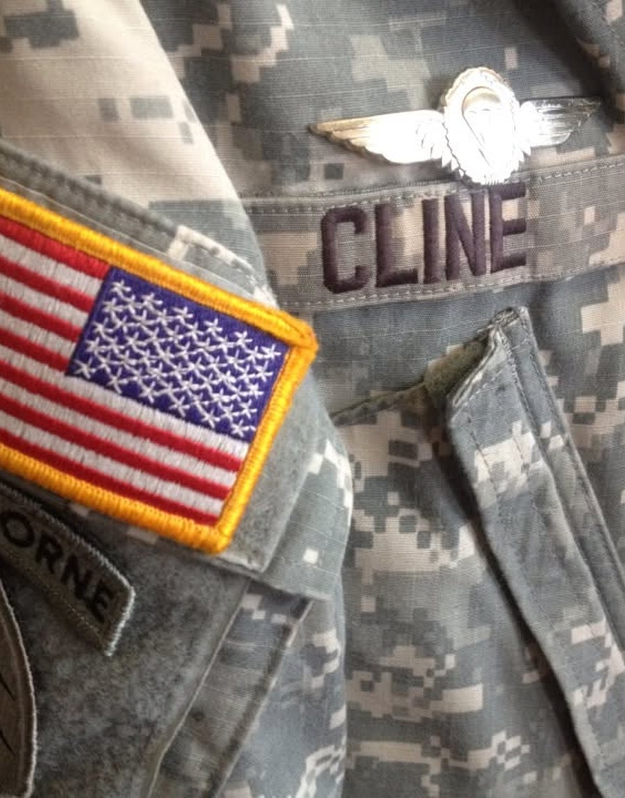 Close view of Mike Cline’s service uniform, name, flag, and airborne insignia