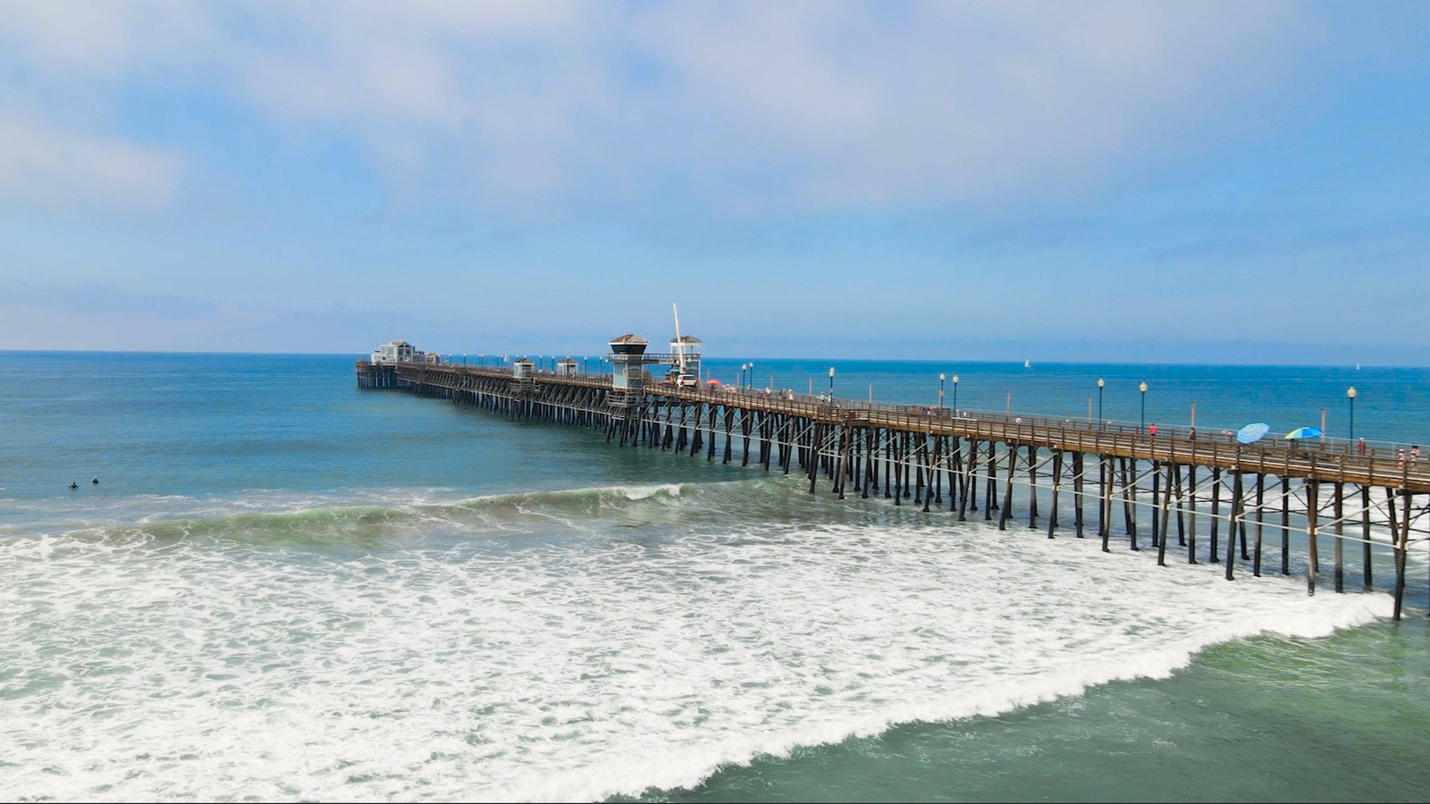 Oceanside Pier above rolling Pacific waves