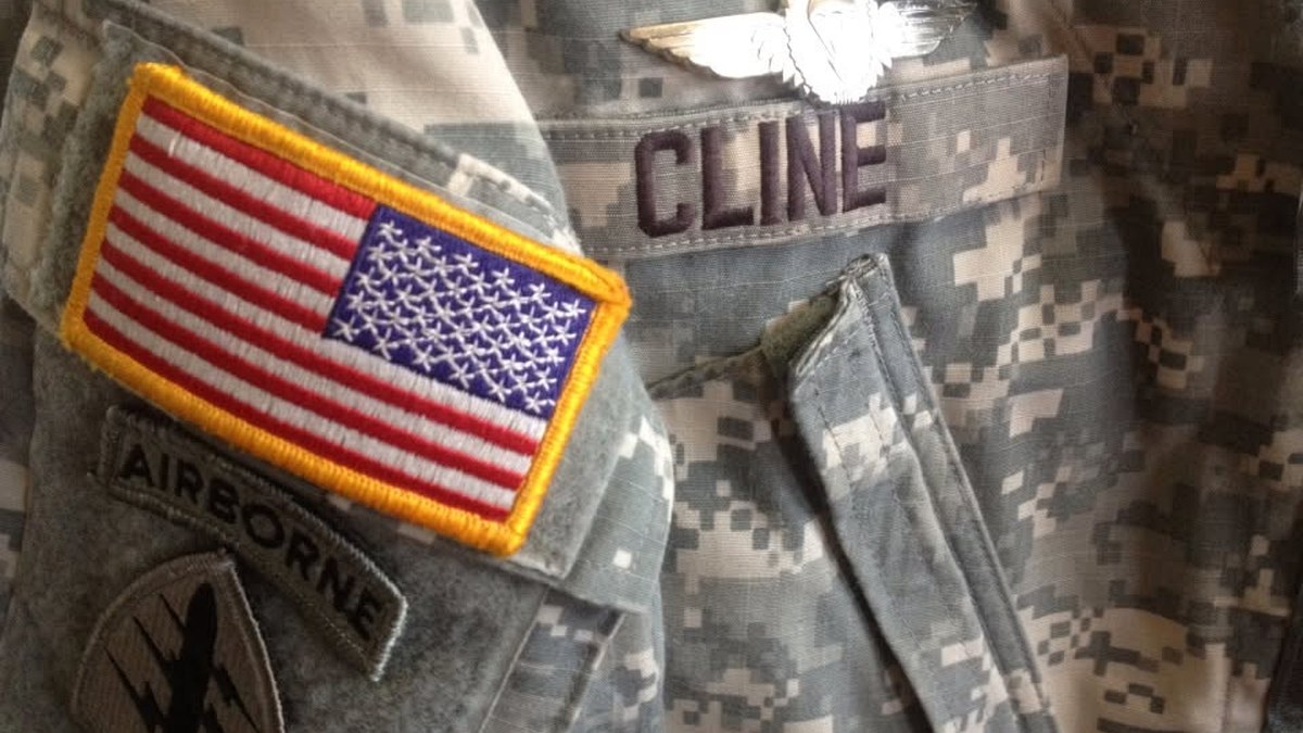 Mike Cline service uniform with name, flag, and airborne insignia